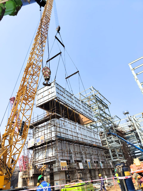 A pre-assembled module lifted into place — less work on site, faster start-up.