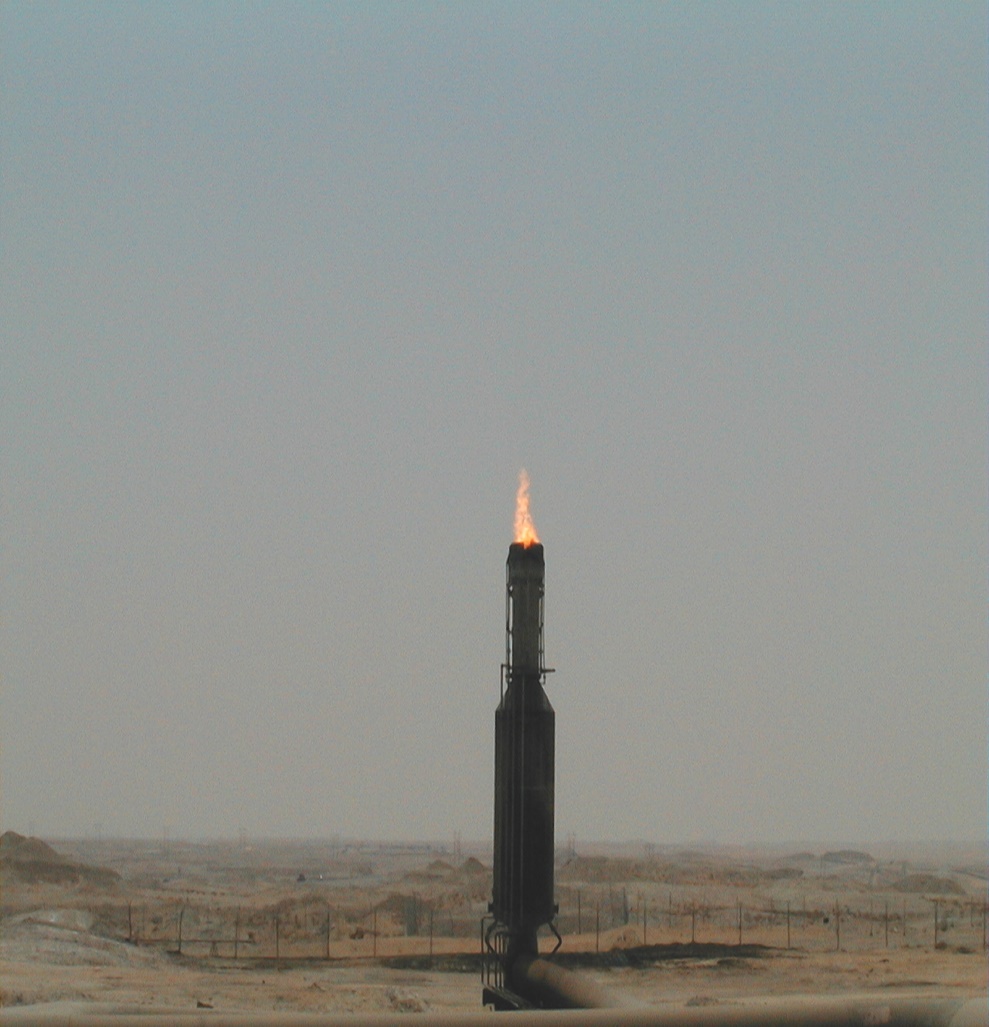 Flare stack after HP Air Assist — clean small blue flame with no visible smoke, low-emission state